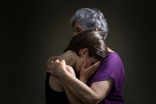 A woman and her grandmother grieving together in Stockbridge, Georgia