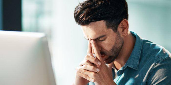 Visibly-Upset-Man-Sitting-at-a-Computer