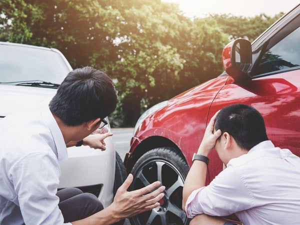 Two-Drivers-Assessing-a-Car-Accident-Scene